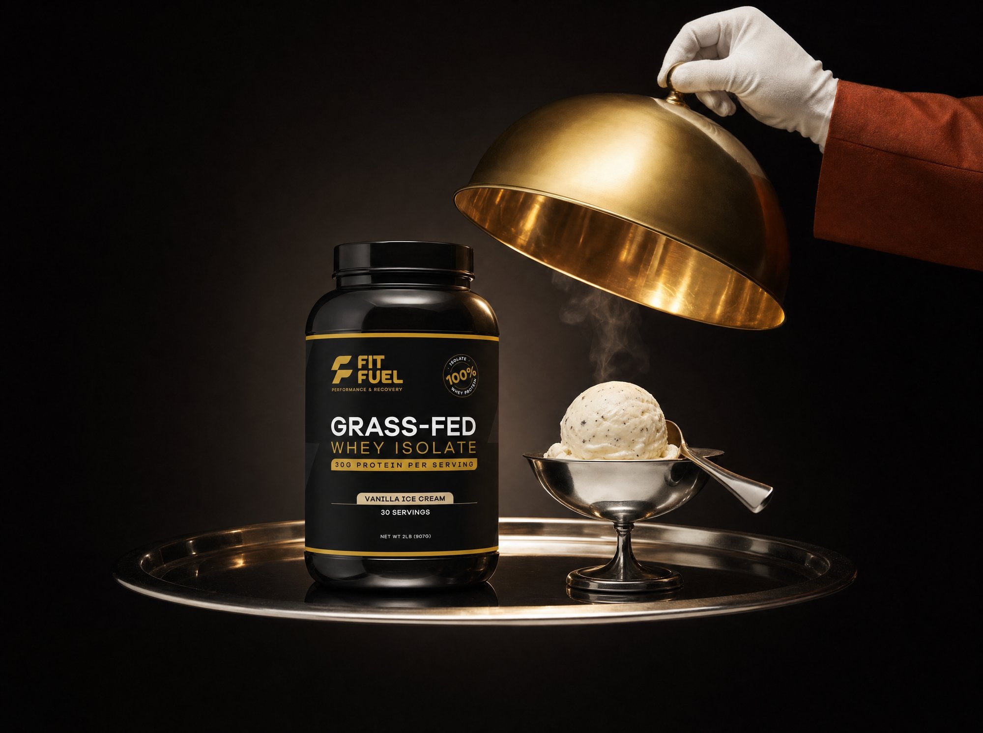 A gold cloche lifting to reveal the FitFuel jar served with a scoop of vanilla ice cream
